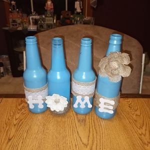 Painted decorated bottles spelling Home